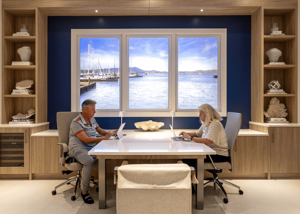 Man and woman working in front of LiquidView digital windows