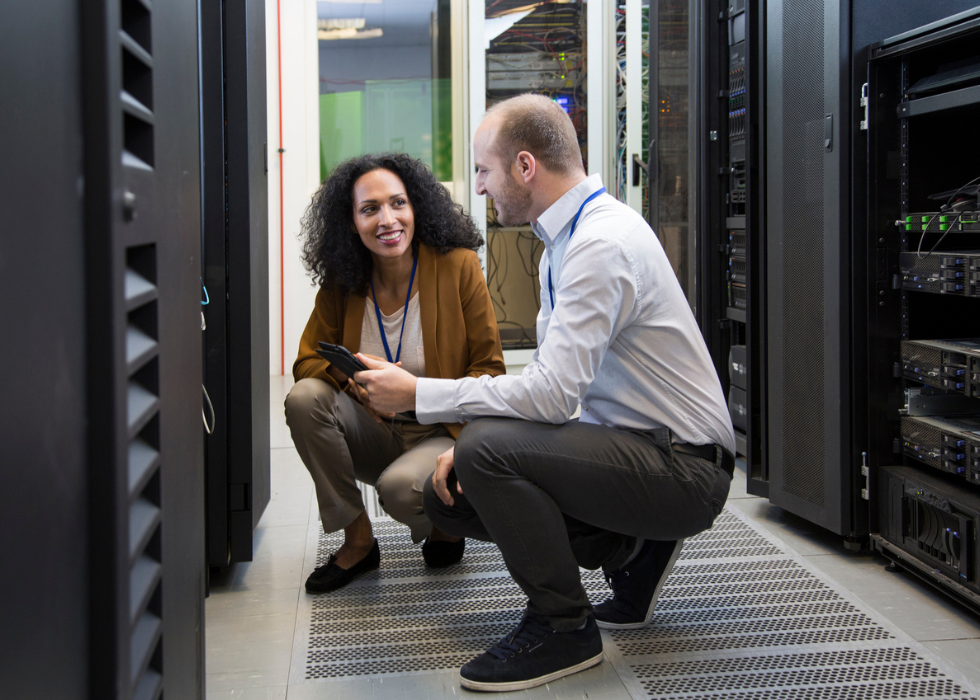 man and woman in AV control room