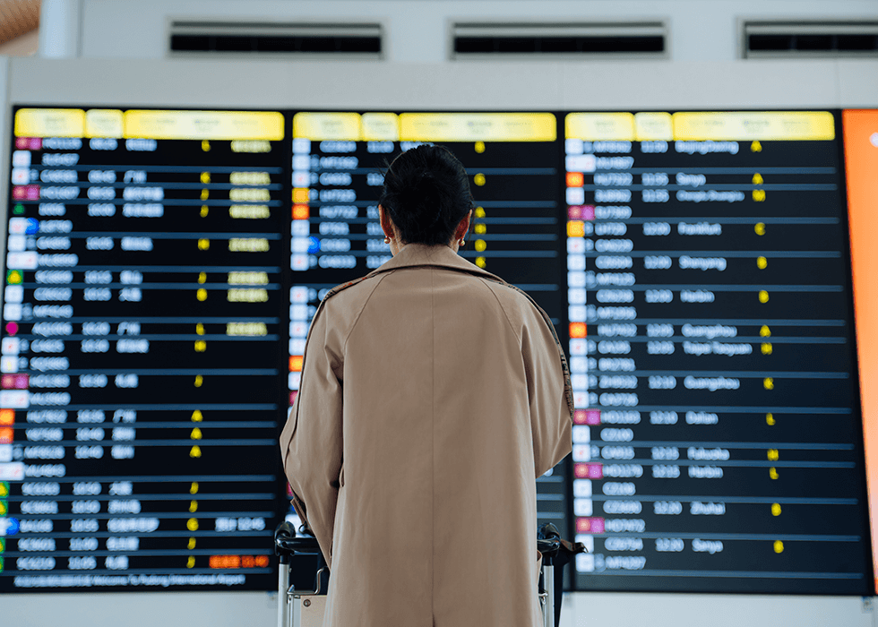 digital_signage_player Woman from behind looking at digital signage in airport
