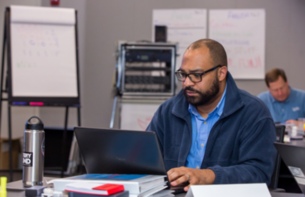 man studying on laptop