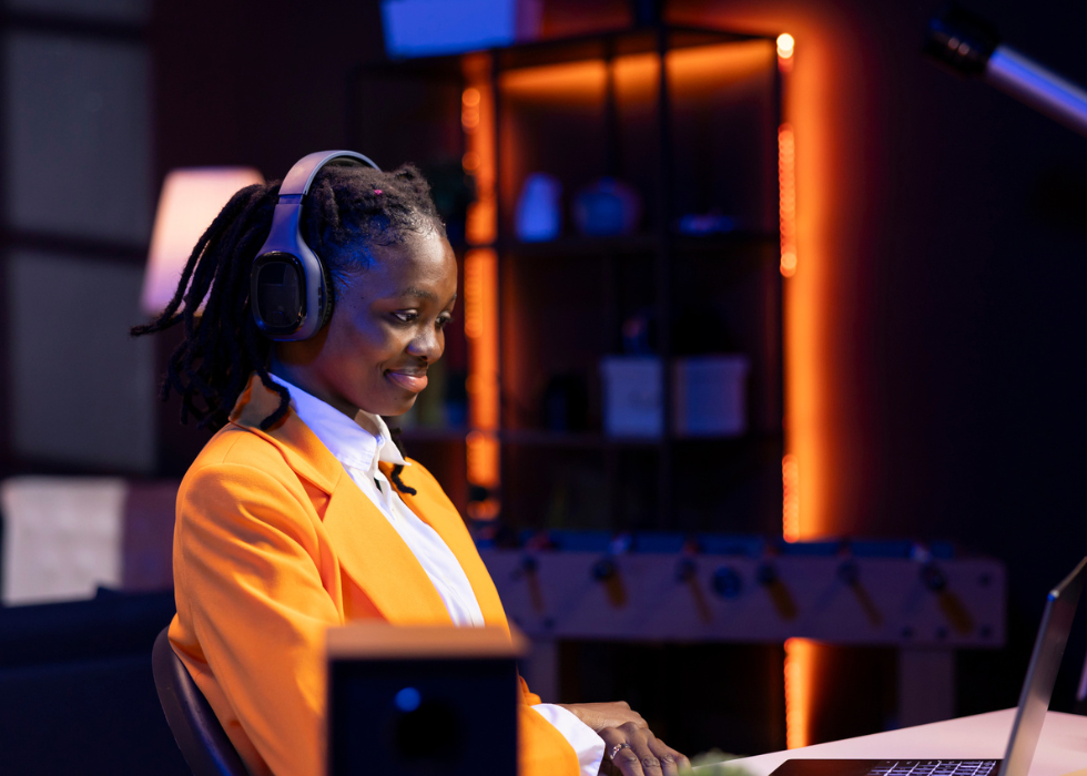 woman smiling at laptop