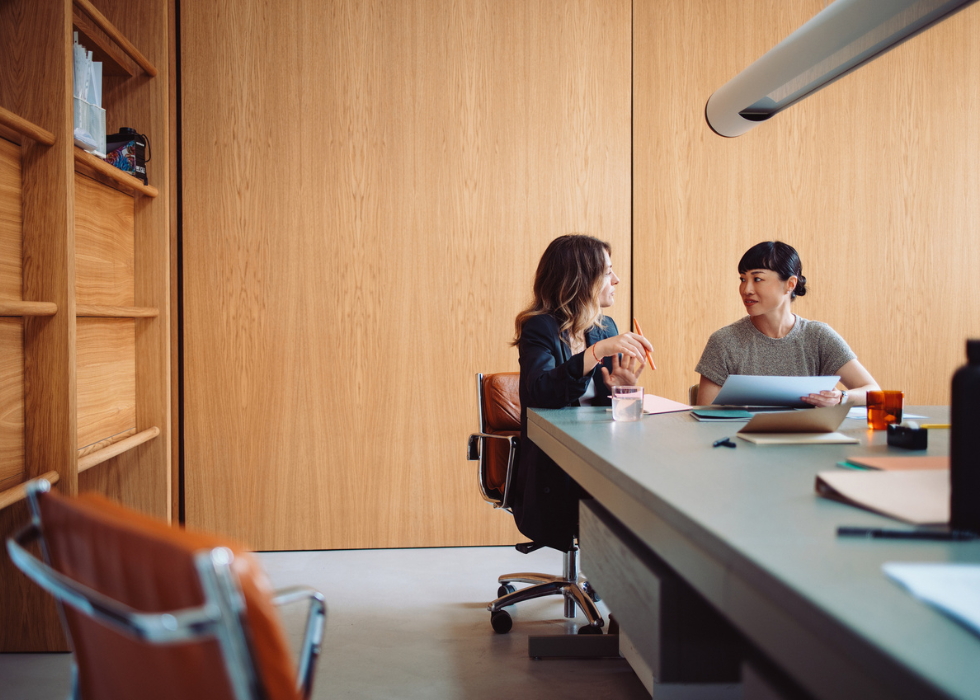 women working at conference table