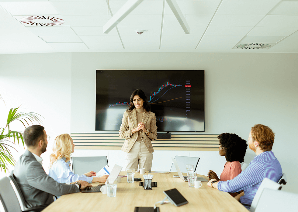 office_speakers Woman giving presentation in conference room