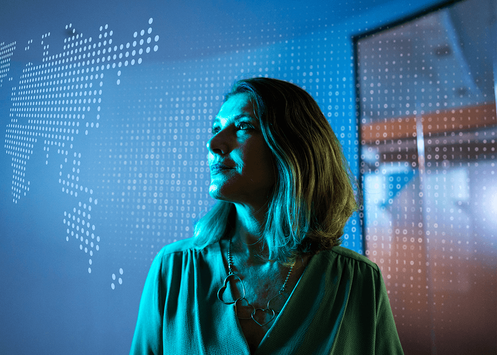 september_news_roundup businesswoman looking to a hologram at office