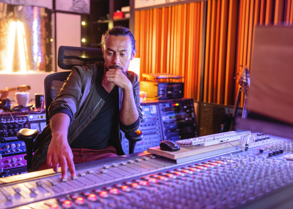 Sound recording engineer in a colorful studio