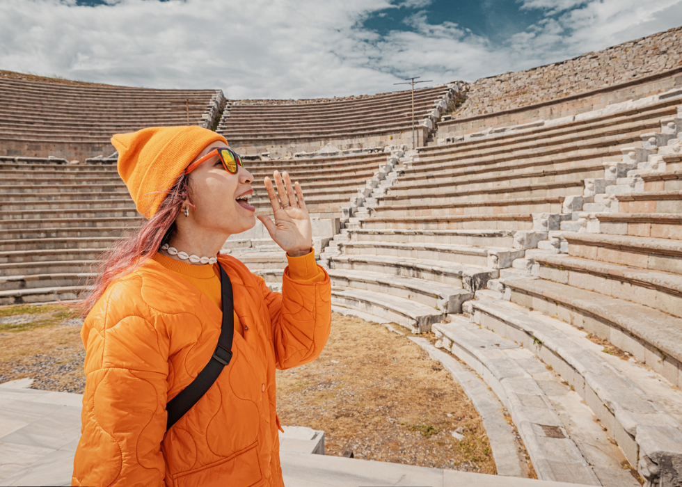 girl testing acoustics at outdoor amphitheater