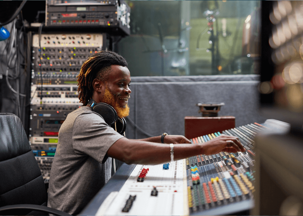 august_av_roundup Man working in studio with a sound board