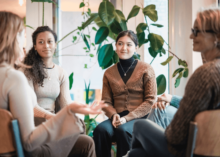 Women discussing in a circle