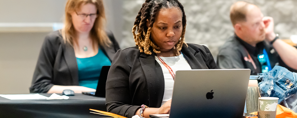 Woman taking a test on laptop
