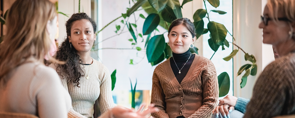 Women siting in circle chatting