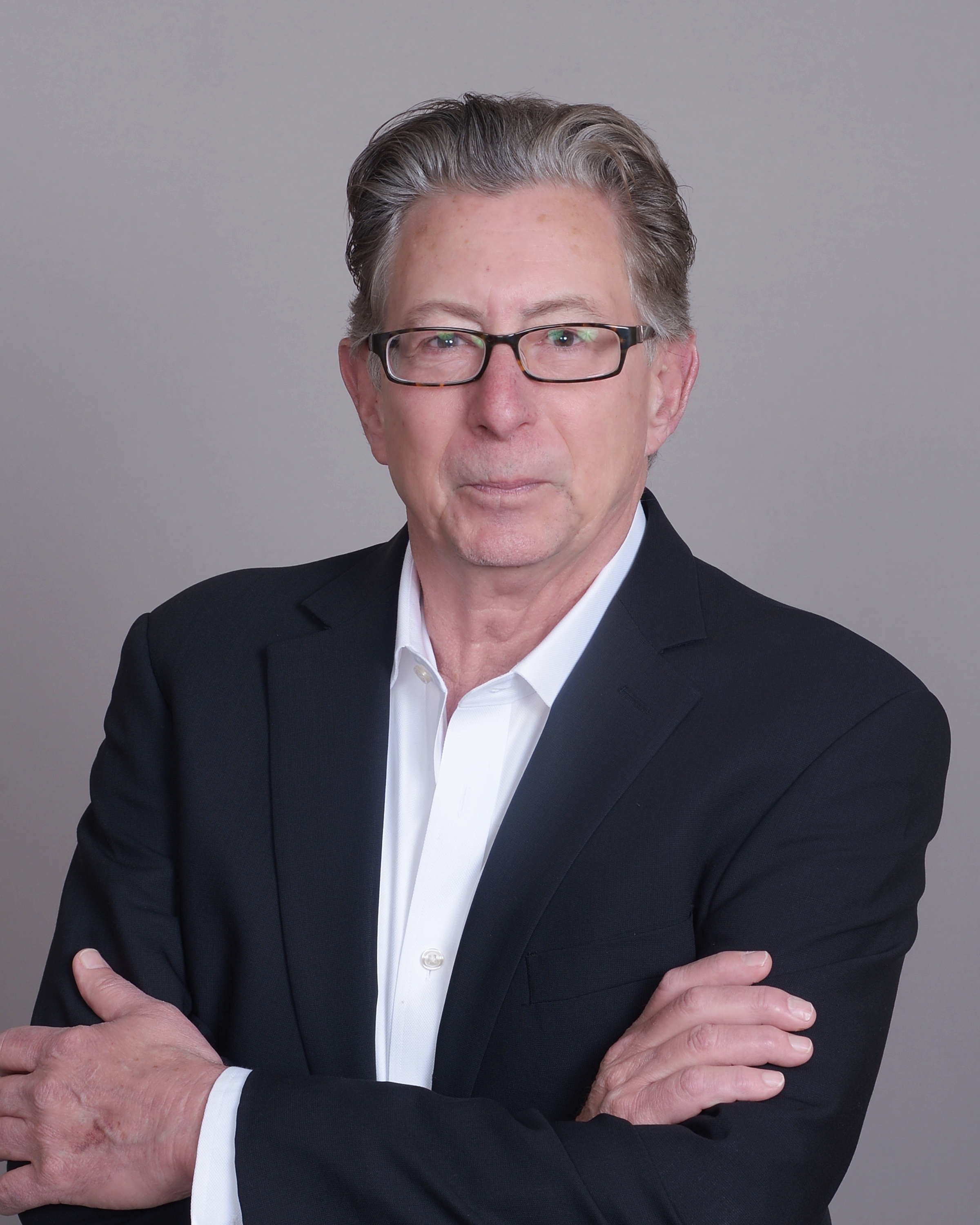 Headshot of Ted Ritter with arms crossed