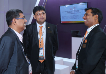 Businessmen chatting at InfoComm