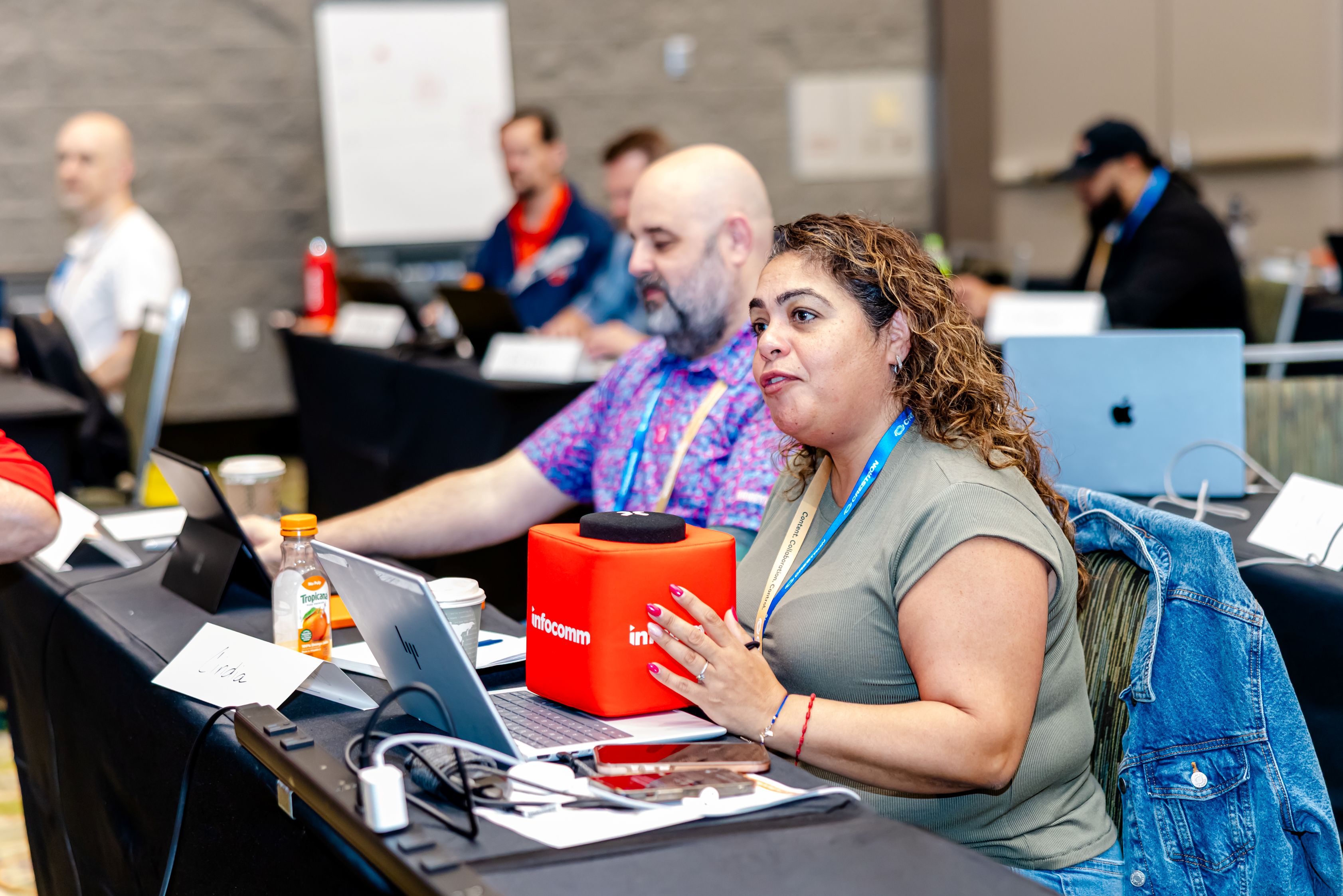 woman holding cube microphone