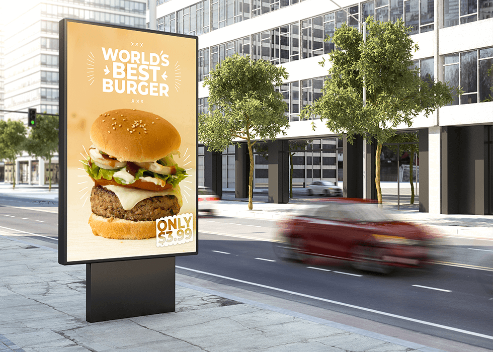 Digital burger advertisement on side of road