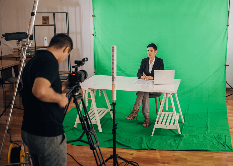 People shooting a video with green screen