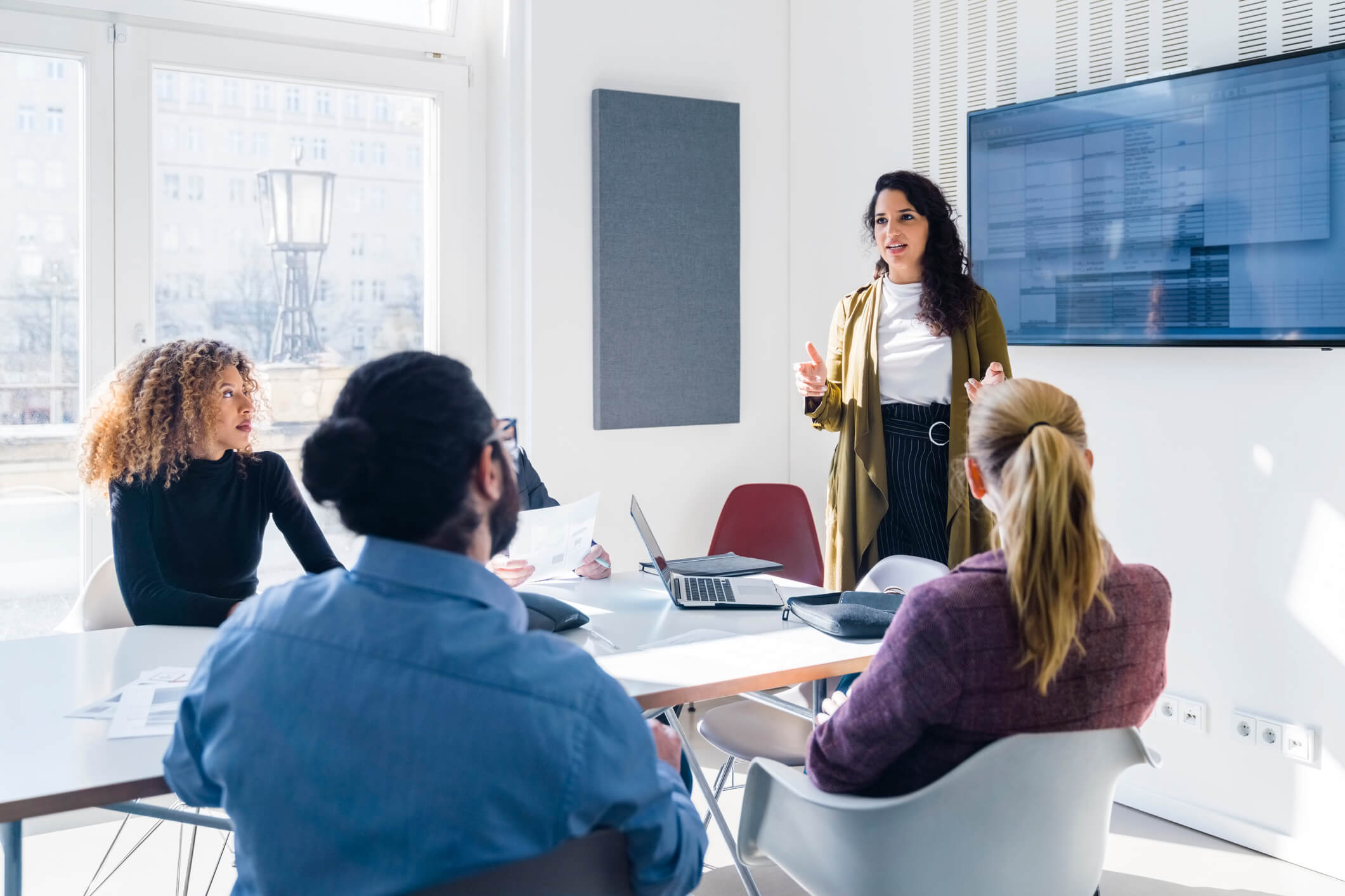 Woman giving a presentation in a meeting room