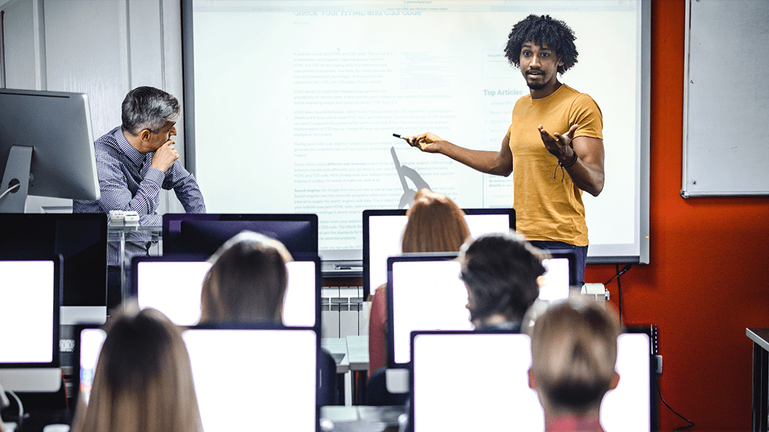 short_throw_ratio Person presenting in front of a college classroom