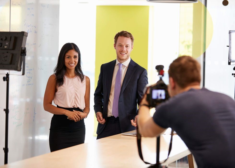 People being recorded by corporate videographer