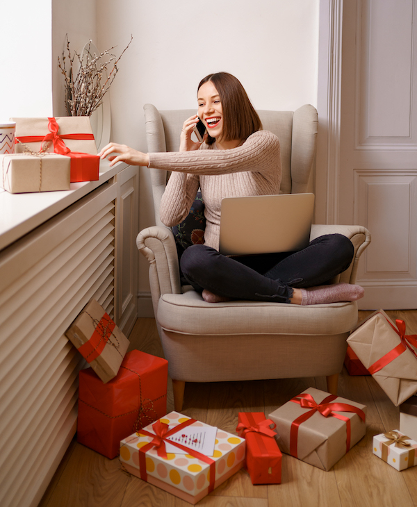 Woman sitting with presents | AVIXA